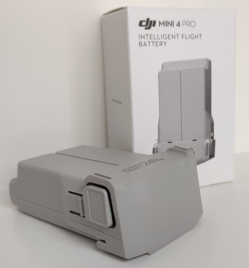 Battery for DJI Mini 4 Pro — battery lying diagonally with packaging